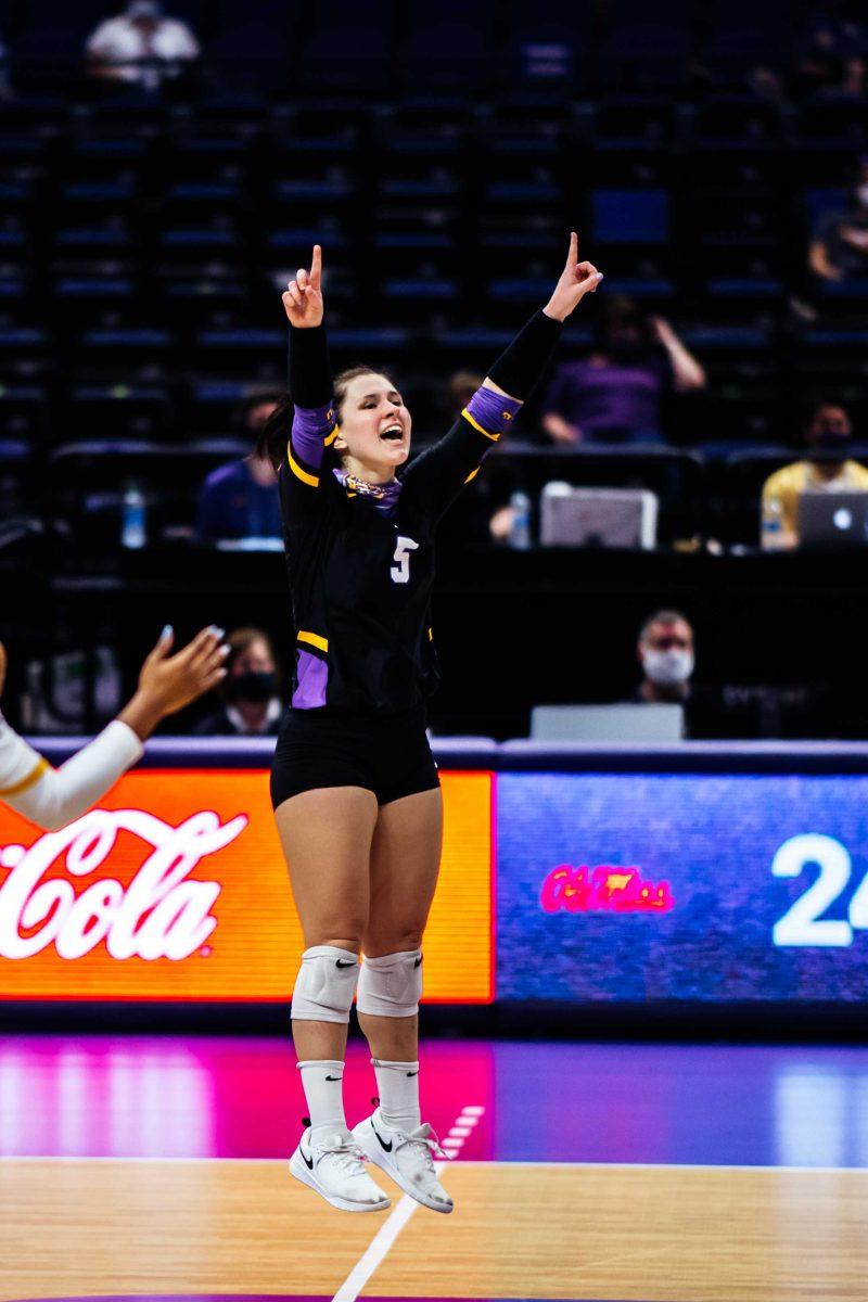 LSU volleyball senior libero Raigen Cianciulli (5) jumps up and celebrates after she scores a point Sunday, Feb. 28, 2021 during LSU's 2-3 loss against Ole Miss in the Pete Maravich Assembly Center on N. Stadium Drive in Baton Rouge, La.