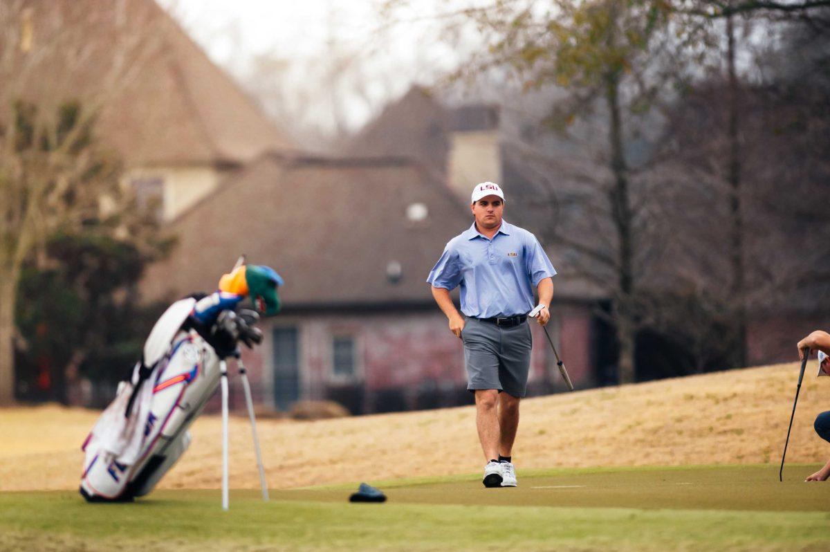 LSU men's golf freshman Nicholas Arcement walks back after he completes the first hole Friday, Feb. 26, 2021 during the LSU Invitational hosted at the University Club on Memorial Tower Drive in Baton Rouge, La.