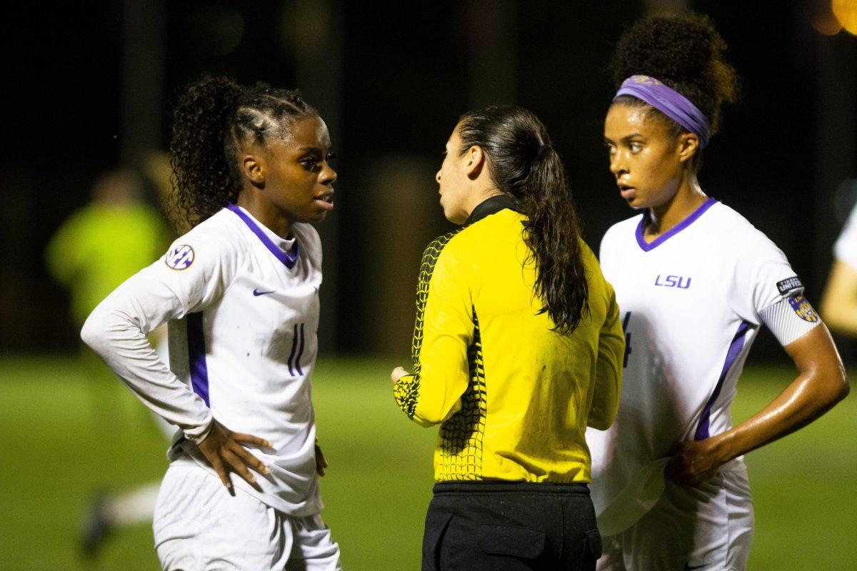 LSU soccer redshirt senior forward Tinaya Alexander (11) and fifth year senior midfielder Chiara-Ritchie Williams (4) talk to an official Friday, Sept. 17, 2021, during their 2-0 win against Mississippi State at the LSU Soccer Stadium in Baton Rouge, La.