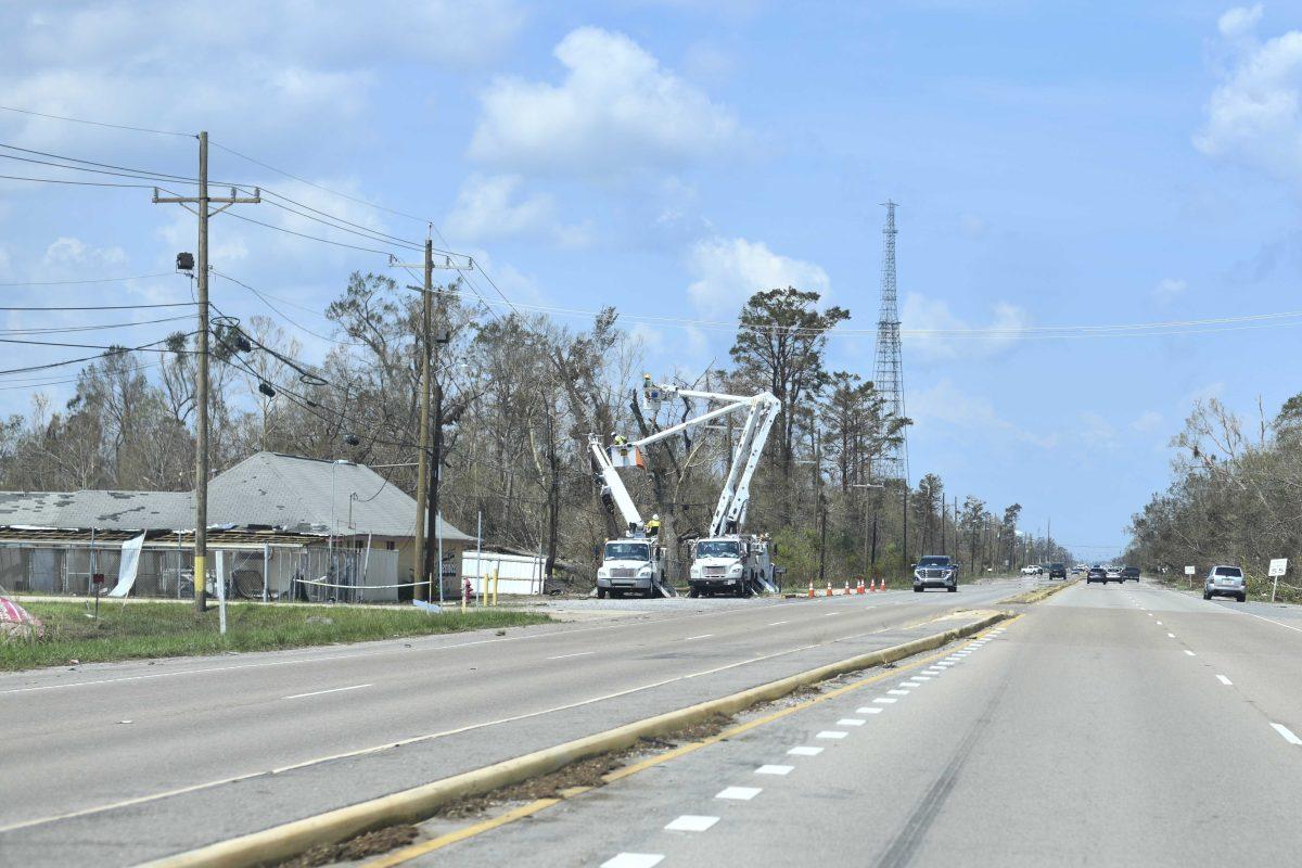 Linemen help restore power Friday, Sept. 3, 2021, five days after Hurricane Ida made landfall on Airline Highway in St. John the Baptist Parish.