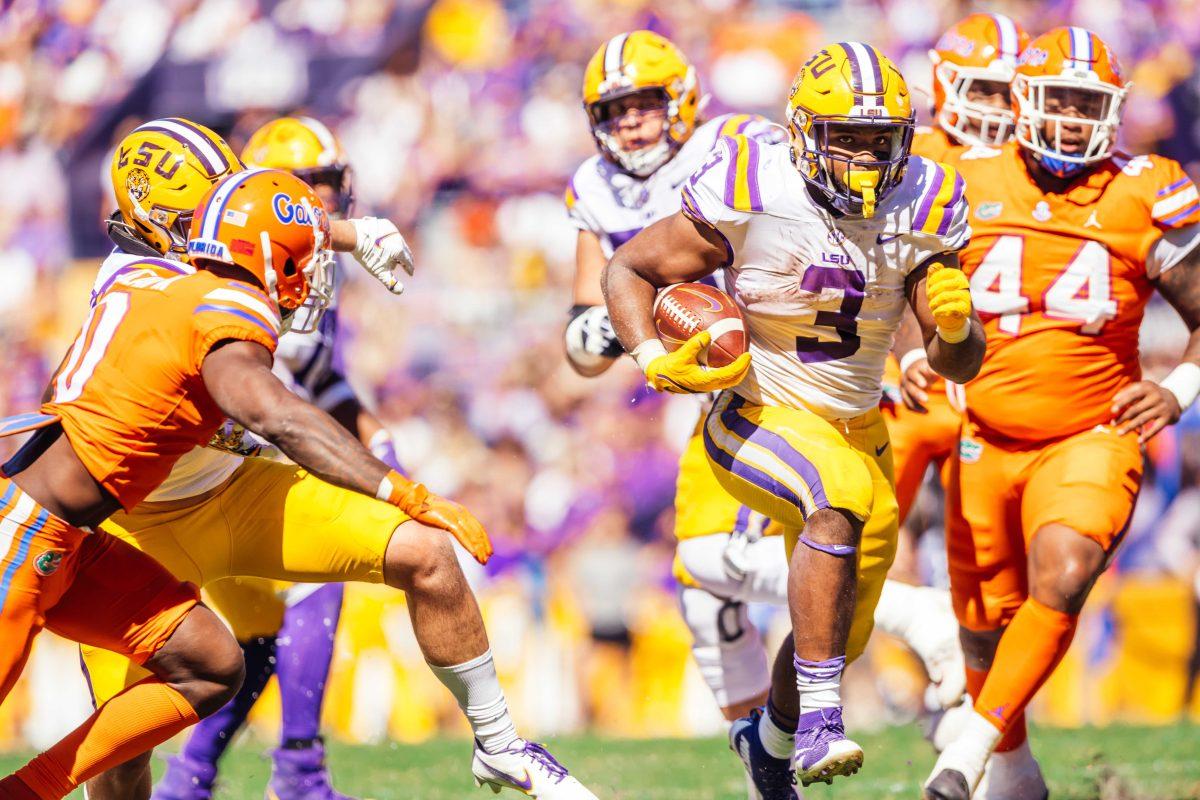 LSU football junior running back Tyrion Davis-Price (3) run the ball Saturday, Oct. 16, 2021, during LSU's 49-42 win against Florida at Tiger Stadium in Baton Rouge, La.