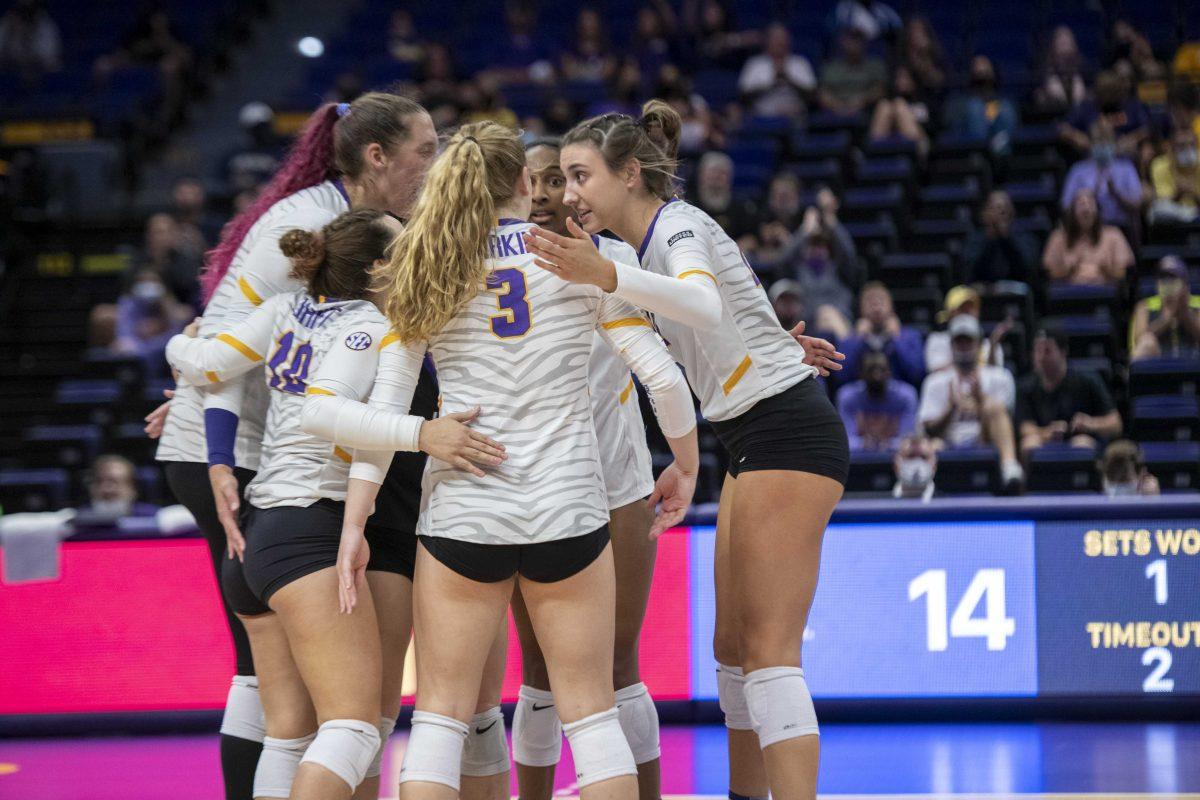 The LSU volleyball team quickly huddles after a point was scored Friday, Oct. 15, 2021, during LSU's 0-3 defeat to Kentucky in the Pete Maravich Assembly Center on N. Stadium Drive in Baton Rouge, La.