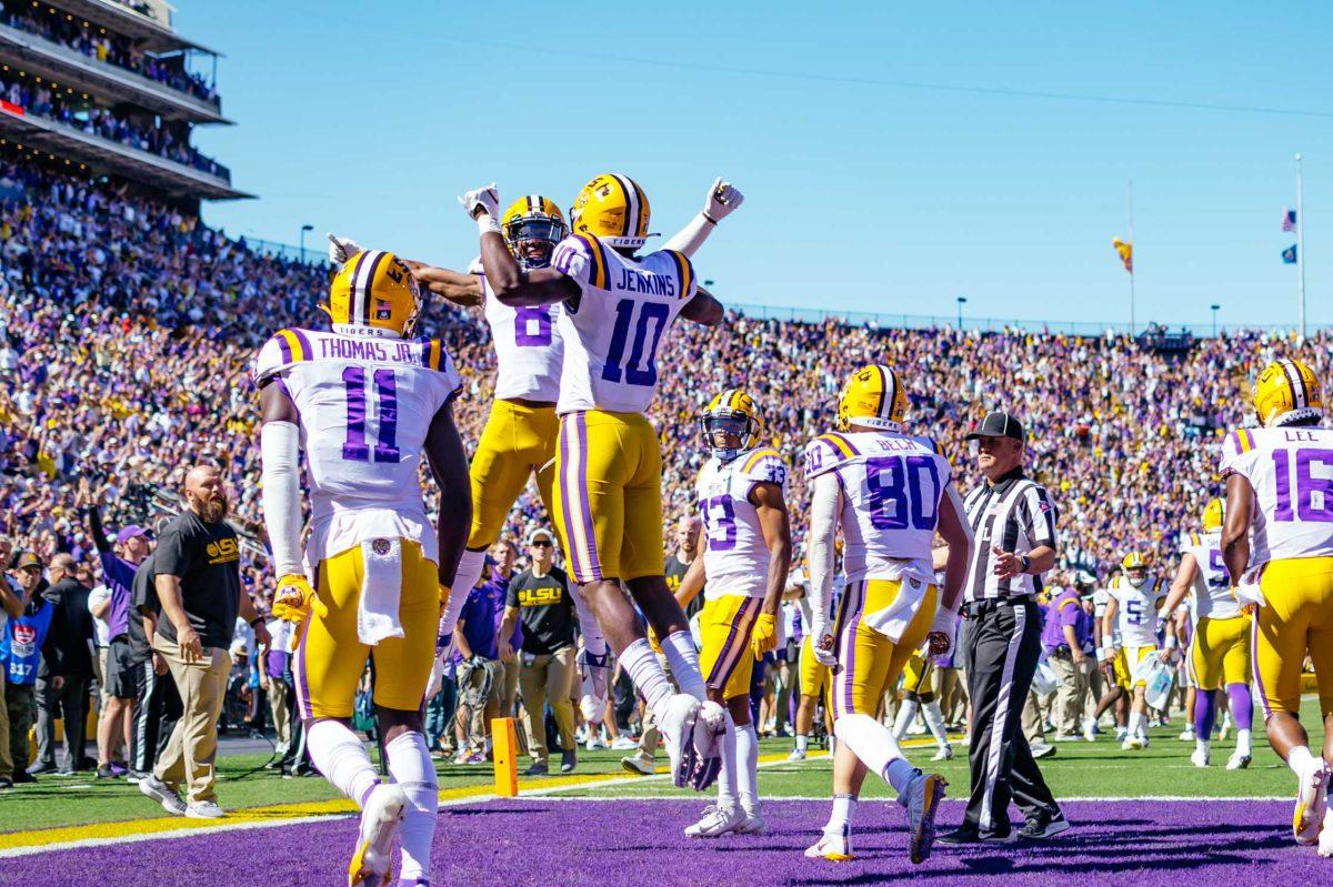 LSU football junior wide receiver Jaray Jenkins (10) celebrates his touchdown and chest bumps freshman wide receiver Malik Nabers (8) Saturday, Oct. 16, 2021, during LSU's 49-42 win against Florida at Tiger Stadium in Baton Rouge, La.