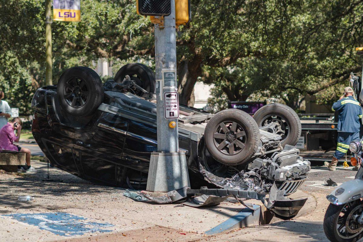 A black Jeep sits overturned on Thursday, Oct. 21, 2021, on Highland Road near the LSU Student Union in Baton Rouge, La.