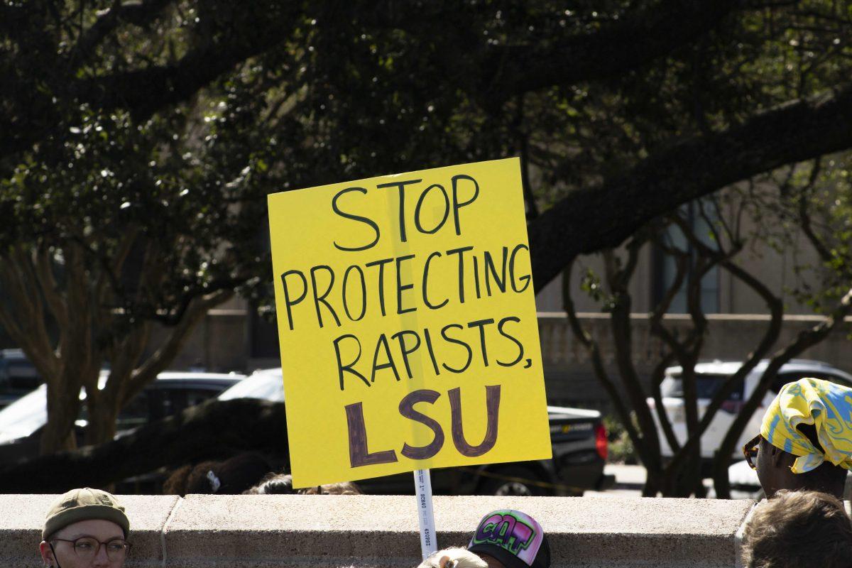 A LSU student holds up a sign demanding change Monday, Oct. 18, 2021, during the Feminists in Action protest following reports of LSU mishandling sexual assault cases on the Parade Ground at LSU's campus.