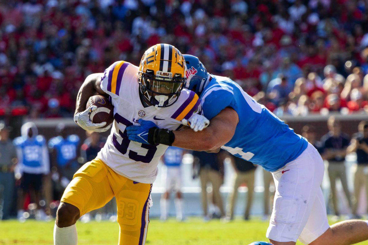 LSU football junior wide receiver Trey Palmer (33) attempts to break a tackle on Saturday, Oct. 23, 2021, during LSU's 31-17 loss against the University of Mississippi, in Vaught-Hemingway Stadium, Oxford, Mississippi.