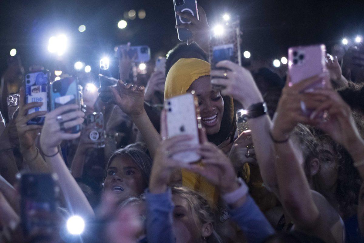 LSU students smile on Tuesday, Oct. 12, 2021, as they watch Swae Lee's performance at the LSU homecoming concert on the Parade Ground at LSU's campus.