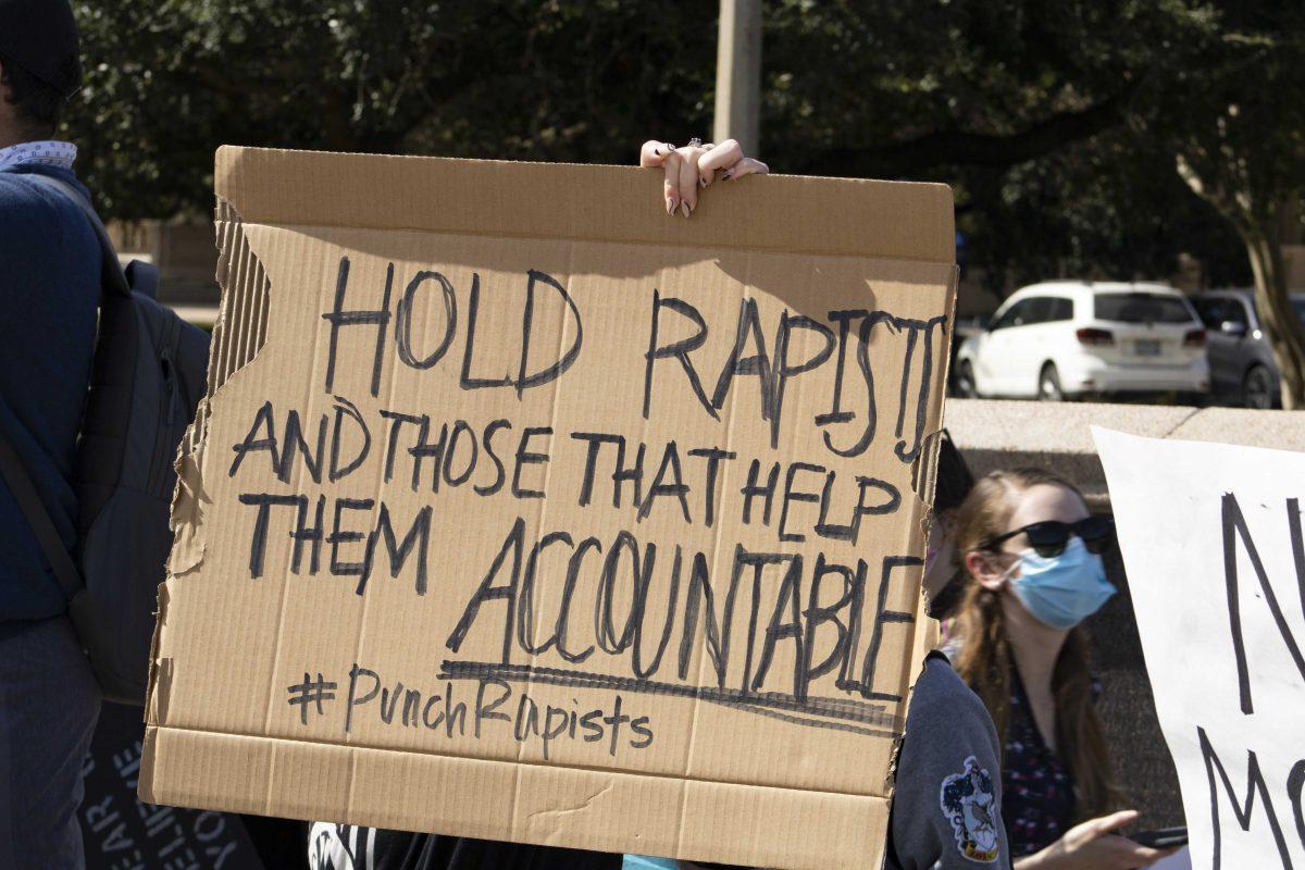 A LSU holds a sign in protest Monday, Oct. 18, 2021, during the Feminists in Action protest following reports of LSU mishandling sexual asssault cases on the Parade Ground at LSU's campus.