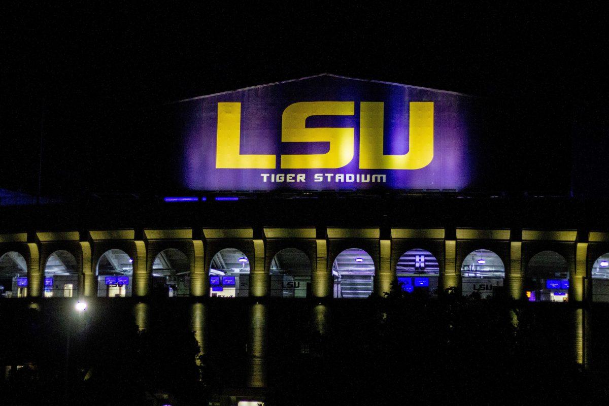 LSU's logo shines on Tiger Stadium at night on LSU's Campus, Tuesday, Aug. 24, 2021.