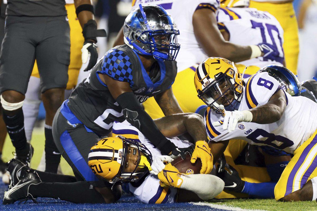 LSU running back Tyrion Davis-Price, center, waits for confirmation of his touchdown during the second half of the team's NCAA college football game against Kentucky in Lexington, Ky., Saturday, Oct. 9, 2021. (AP Photo/Michael Clubb)