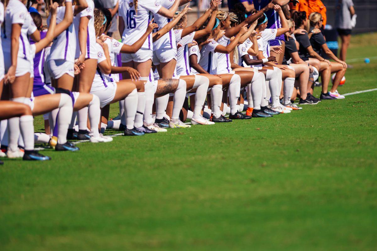 The LSU soccer team takes a knee during the National Anthem Sunday, Sept. 26, 2021 before their 2-1 loss against Georgia at the LSU Soccer Stadium in Baton Rouge, La.