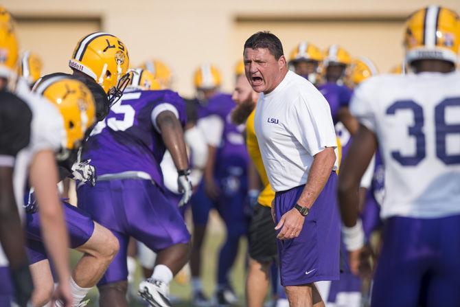 LSU interim head coach Ed Orgeron yells instructions to the players as they run through a drill during an outdoor practice on Tuesday Sept. 27, 2016, on the LSU footbal practice fields at the LSU Football Practice and Training Facilities.