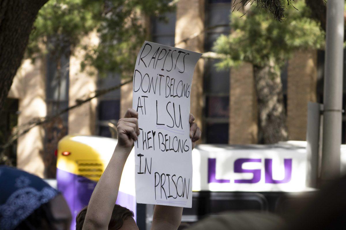 A student holds up a sign Monday, Oct. 18, 2021, after speaking during the Feminists in Action protest following reports of LSU mishandling sexual assault cases at Hodges Hall on LSU's campus.