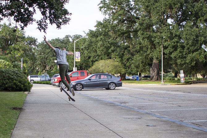 LSU senior history major Charles Desobry skates near the Clock Tower on Friday, Oct. 26, 2018.