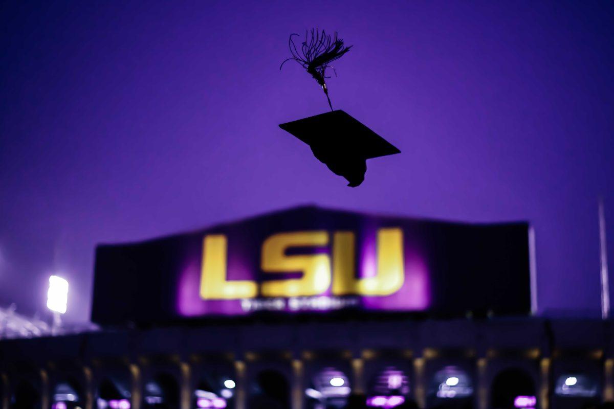 LSU leadership and human resource development graduate Aimee Ardonne throws up her cap for a photo Saturday, Aug. 21, 2021, on the ramp of the Pete Maravich Assembly Center in front of Tiger Stadium on N. Stadium Drive in Baton Rouge, La.