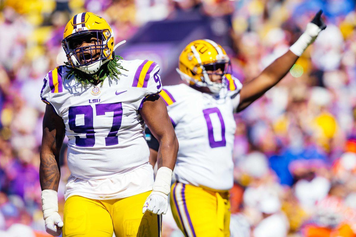 LSU football graduate student defensive tackle Glen Logan (97) screams after a successful play Saturday, Oct. 16, 2021, during LSU's 49-42 win against Florida at Tiger Stadium in Baton Rouge, La.