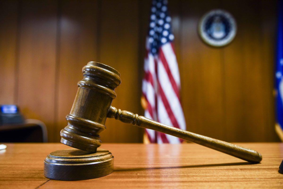 A gavel sits in a court room. courtesy of Wikimedia