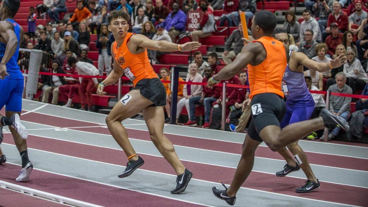 LSU junior transfer sprinter Ashton Hicks prepares to receive the baton in a relay race for OKlahoma State. Courtesy Oklahoma State Athletics