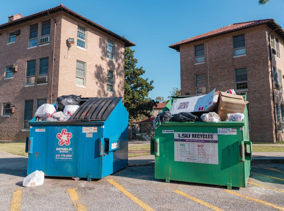 Garbage and recyclables overflow from two dumpsters on Monday, Nov. 1, 2021, by the Pentagon Community in Baton Rouge, La.