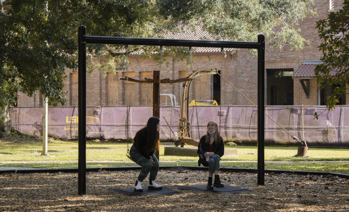 LSU graphic design sophomore Zo&#235; Crawford (left) and graphic design senior Riley Daul (right) chat Wednesday, Nov. 10, in the LSU Sculpture Garden located beside the LSU Art &amp; Design building in Baton Rouge, La.