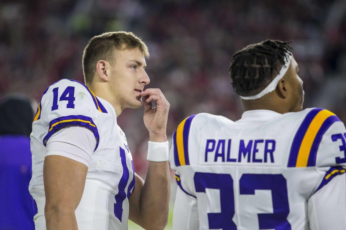 LSU quarterback Max Johnson (14) looks on as Alabama drives the ball into the red zone during the first half of an NCAA college football game, Saturday, Nov. 6, 2021, in Tuscaloosa, Ala. (AP Photo/Vasha Hunt)