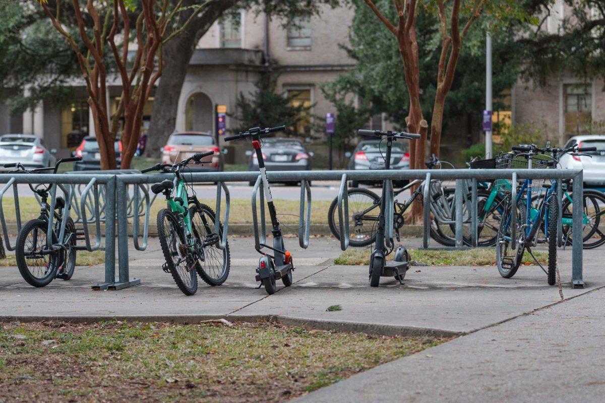 Two scooters sit attached to a bike rack on Wednesday, Nov. 17, 2021, near LSU&#8217;s Lockett Hall in Baton Rouge, La.