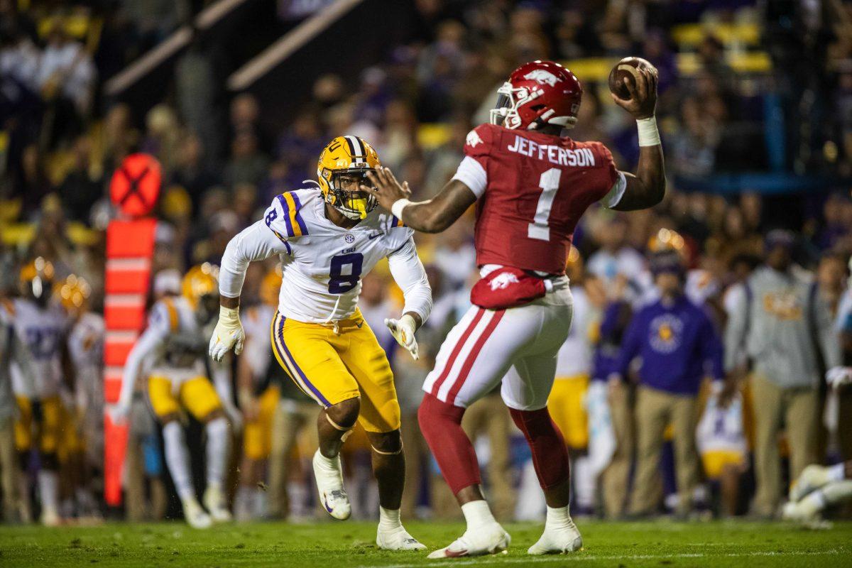 LSU football sophomore defensive end BJ Ojulari (8) prepares to hit an Arkansas quarterback Saturday, Nov. 13, 2021, during LSU's 16-13 loss against Arkansas at Tiger Stadium in Baton Rouge, La.