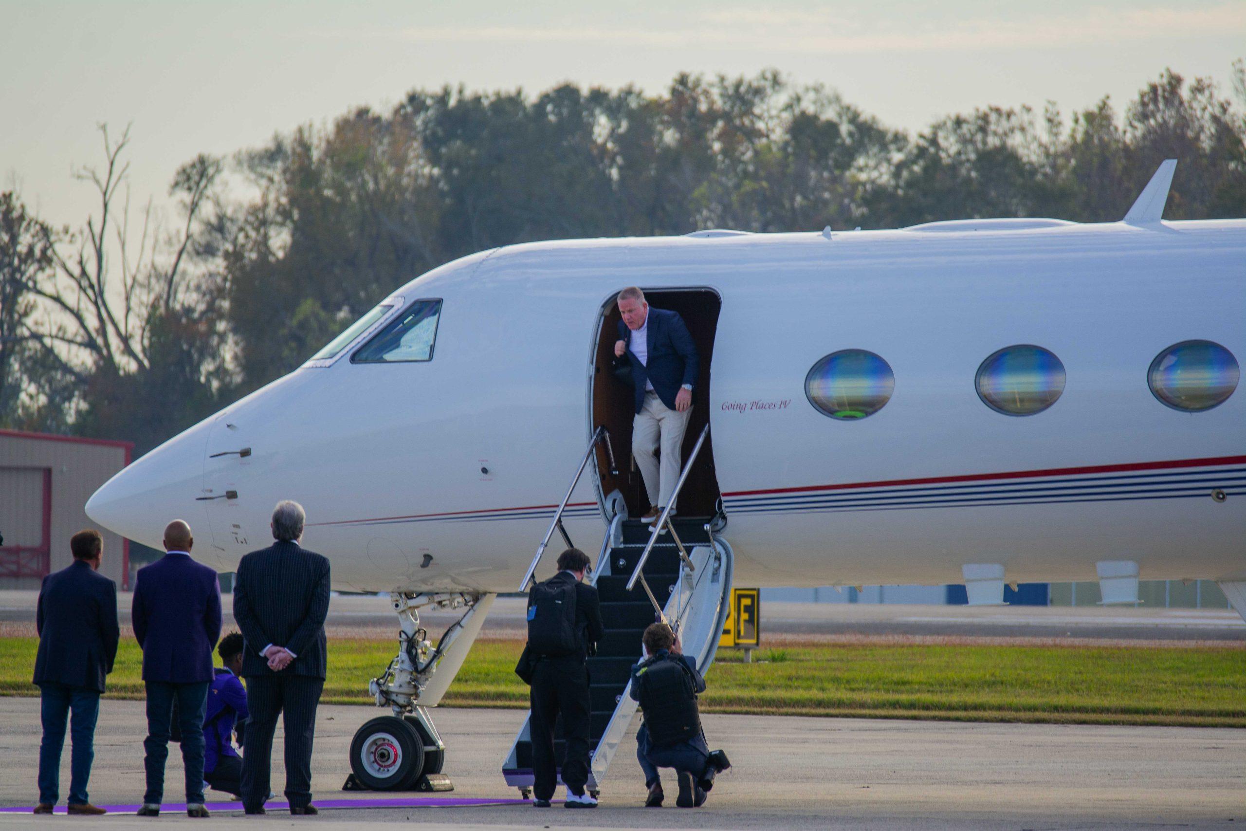 PHOTOS: Newly hired LSU football head coach Brian Kelly and family fly into Baton Rouge