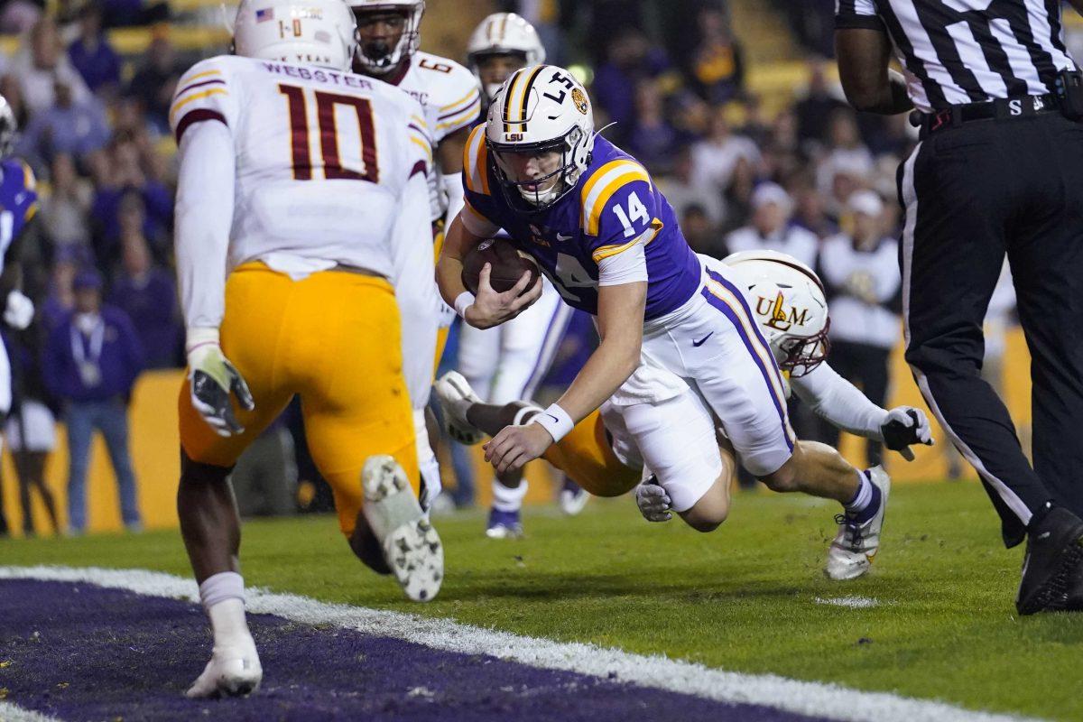 LSU quarterback Max Johnson (14) carries for a touchdown in the first half of an NCAA college football game against Louisiana-Monroe in Baton Rouge, La., Saturday, Nov. 20, 2021. (AP Photo/Gerald Herbert)