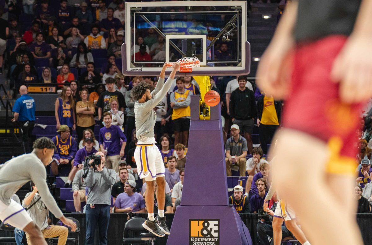 LSU basketball freshman center Efton Reid (15) dunks during warmups on Tuesday, Nov. 9, 2021, during LSU&#8217;s 101-39 victory over ULM in the Pete Maravich Assembly Center on North Stadium Drive in Baton Rouge, La.