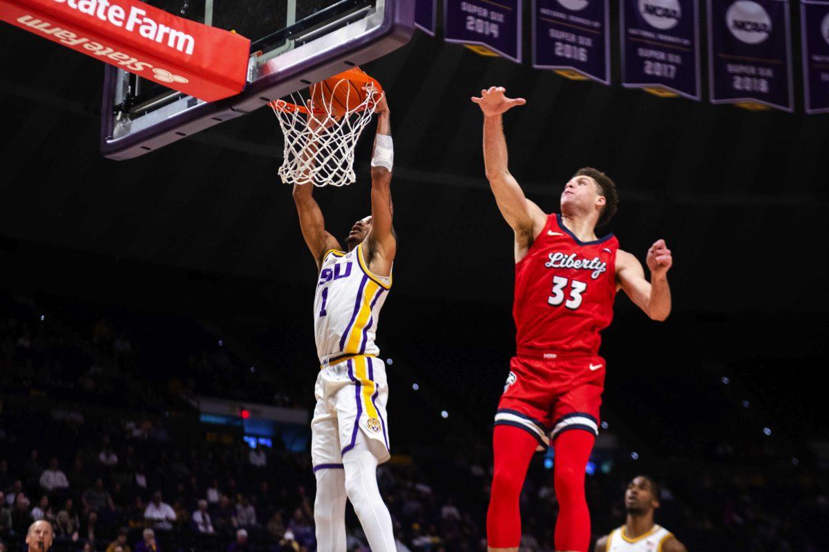 LSU men&#8217;s basketball senior guard Xavier Pinson (1) rises up for a fastbreak dunk Monday, Nov. 15, 2021, during LSU&#8217;s 74-58 win against Liberty in the Pete Maravich Assembly Center on North Stadium Drive in Baton Rouge, La.