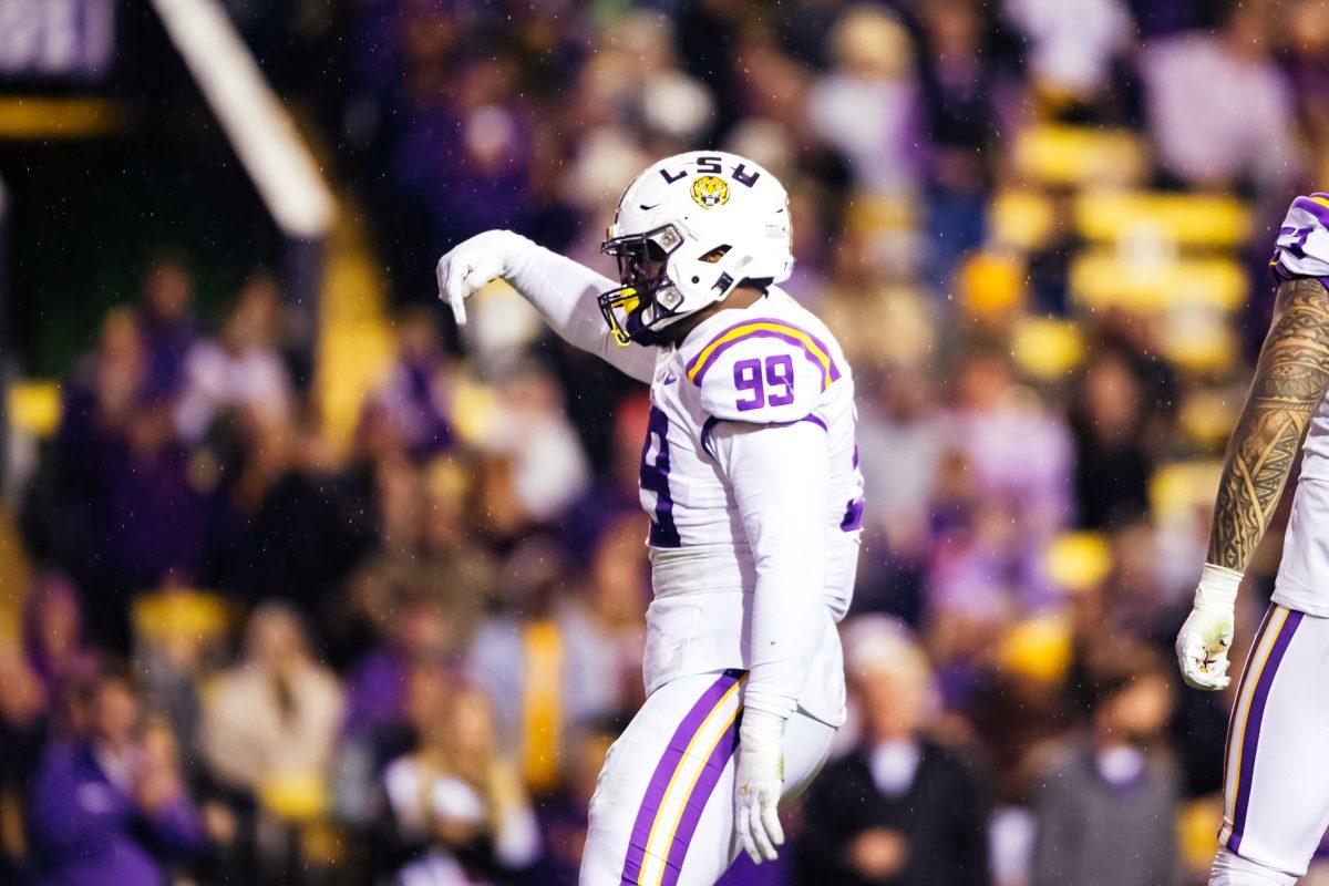 LSU football sophomore defensive tackle Jaquelin Roy (99) points down towards Texas A&amp;M fans in the stands Saturday, Nov. 27, 2021, during LSU's 27-24 win against Texas A&amp;M at Tiger Stadium in Baton Rouge, La.