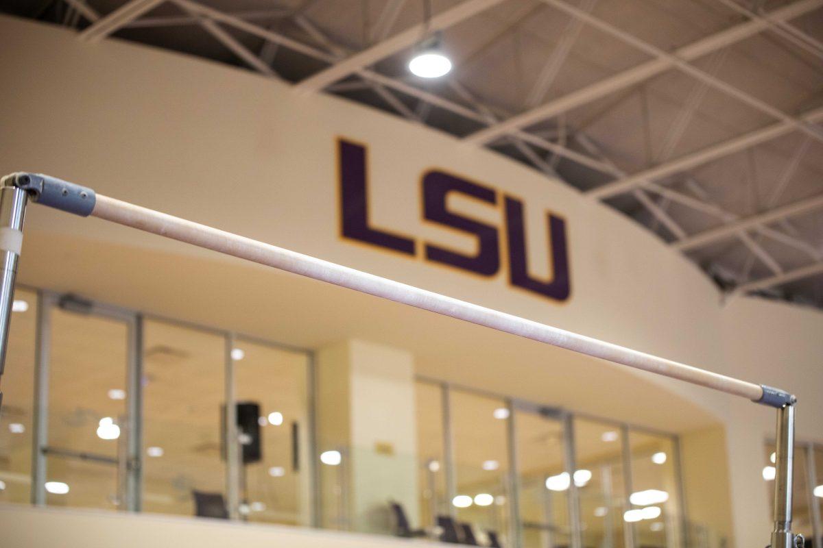 Chalk-covered bars reside in The Carol and Tony Savoie Bars Area Tuesday, Oct. 26, 2021, in the LSU Gymnastics Training Facility in Baton Rouge, La.