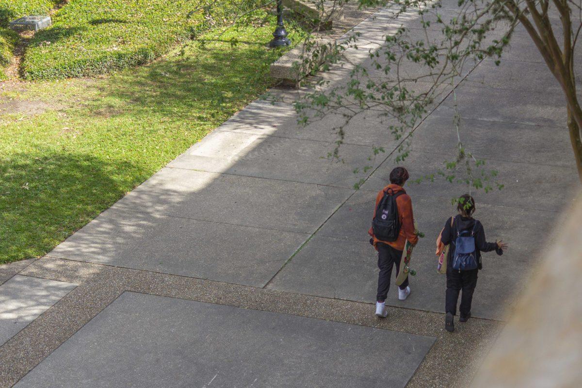 Students walk Friday, Oct. 29, 2021, through the Quad.