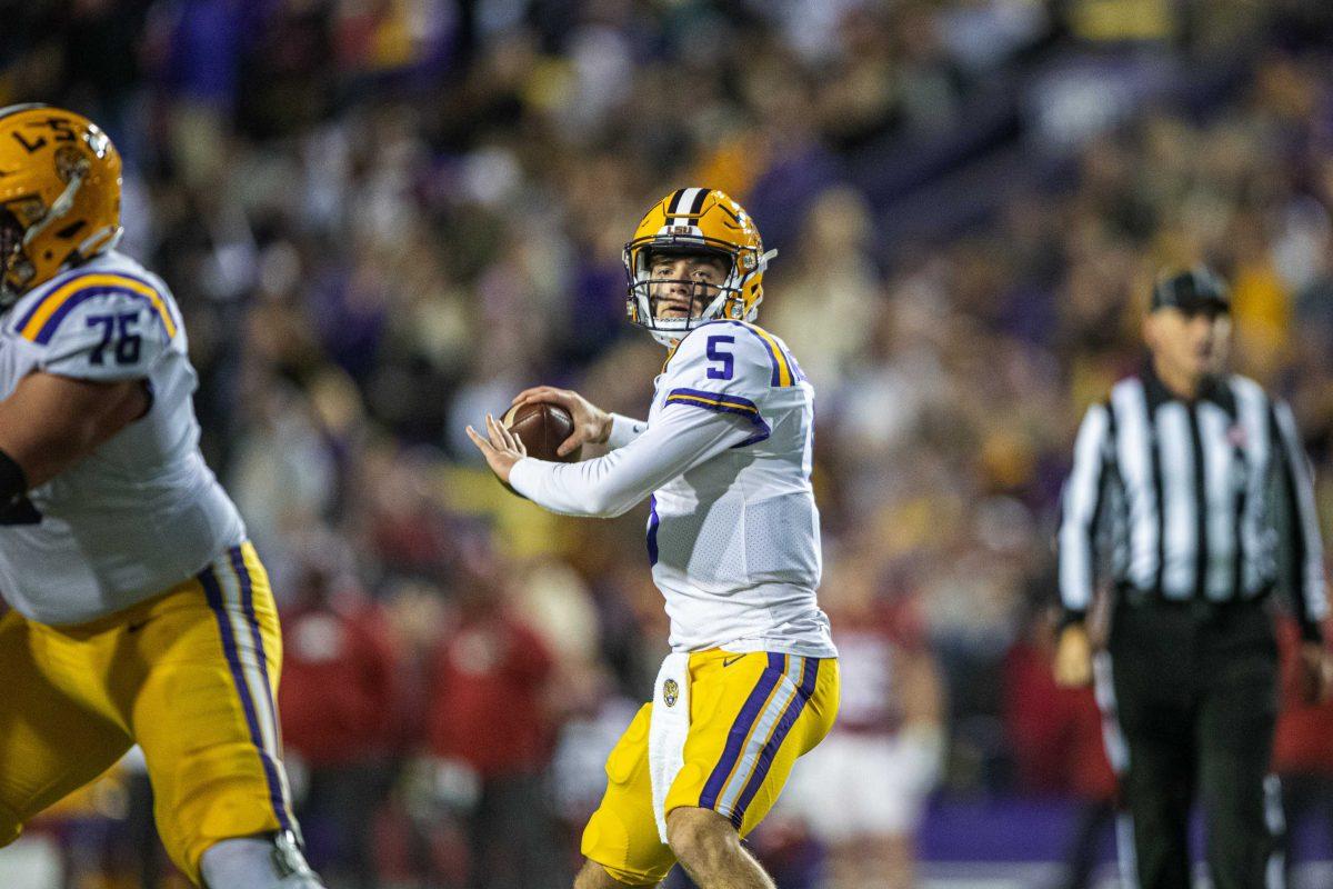 LSU football freshman quarterback Garrett Nussmeier (5) scans down the field Saturday, Nov. 13, 2021, looking for an open receiver during LSU's 16-13 loss against Arkansas at Tiger Stadium in Baton Rouge, La.