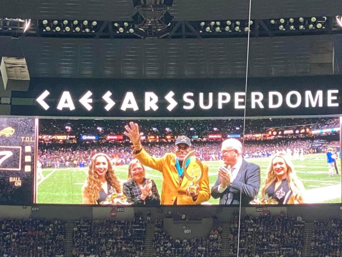 LSU adjunct instructor Herman Kelly waves to the crowd on the Casedars Superdome jumbotron on Nov. 25, 2021, during the Saints vs. Bills game.&#160;