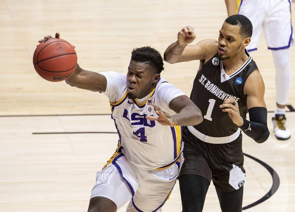 LSU forward Darius Days (4) chases after a loose ball with St. Bonaventure guard Dominick Welch (1) during the first half of a first round game in the NCAA men's college basketball tournament, Saturday, March 20, 2021, at Assembly Hall in Bloomington, Ind. (AP Photo/Doug McSchooler)