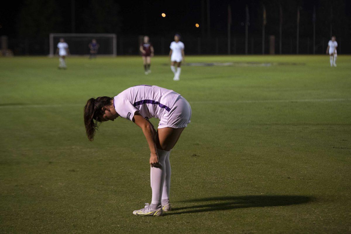 LSU soccer sophomore midfielder Jordan Johnson (15) adjusts her socks Thursday, Oct. 21, 2021 during LSU&#8217;s 4-0 win against South Carolina at the LSU Soccer Stadium in Baton Rouge, La.