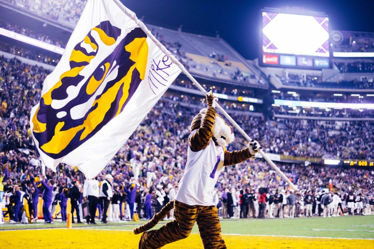 LSU football mascot Mike the Tiger waves a tiger eye flag Saturday, Nov. 27, 2021, during LSU's 27-24 win against Texas A&amp;M at Tiger Stadium in Baton Rouge, La.