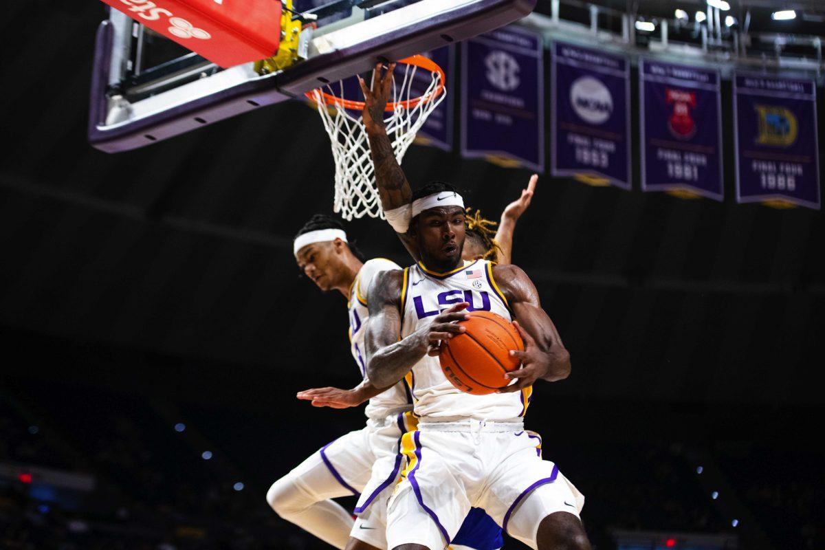 LSU men&#8217;s basketball sophomore forward Tari Eason (13) forcefully grabs a rebound Thursday, Nov. 18, 2021, during LSU&#8217;s 85-46 win against McNeese in the Pete Maravich Assembly Center on North Stadium Drive in Baton Rouge, La.