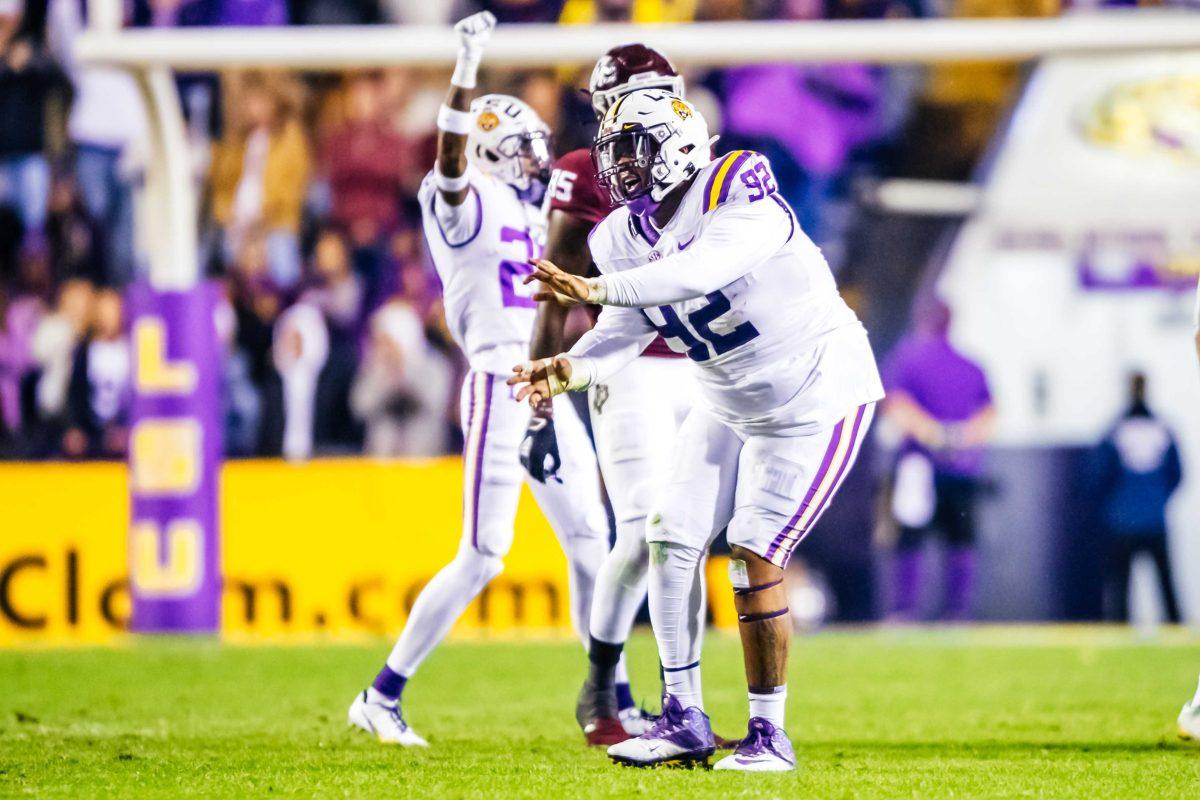 LSU football graduate student defensive tackle Neil Farrell Jr. (92) does the griddy after a successful play Saturday, Nov. 27, 2021, during LSU's 27-24 win against Texas A&amp;M at Tiger Stadium in Baton Rouge, La.