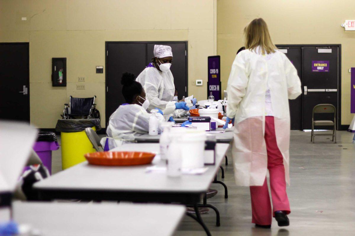 LSU COVID Testing assistants arrange their testing areas for incoming students on Friday, September 10, 2021.