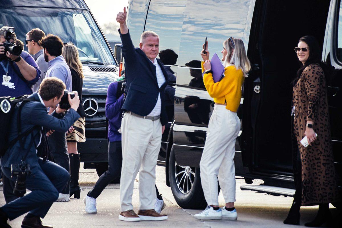 Newly hired LSU football head coach Brian Kelly throws up a thumbs up to LSU fans Tuesday, Nov. 30, 2021, before he takes the van back to LSU at the BTR Jet Center located in the Baton Rouge Metropolitan Airport on 4490 Blanche Noyes Avenue in Baton Rouge, La.