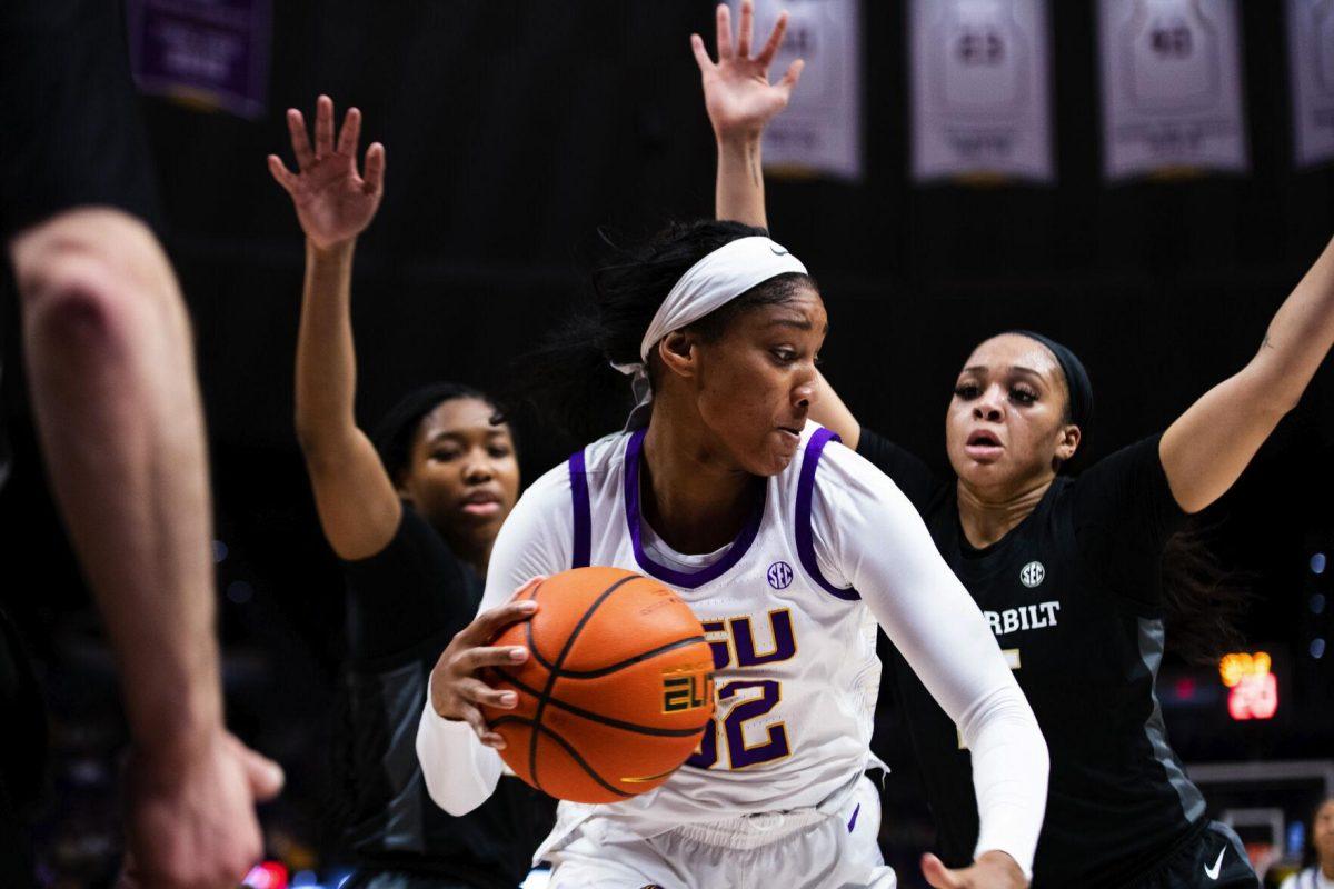 LSU women’s basketball fifth year senior guard Awa Trasi (32) tries to escape a double team Sunday, Jan. 16, 2022, during LSU’s 82-64 win against Vanderbilt in the Pete Maravich Assembly Center on North Stadium Drive in Baton Rouge, La.