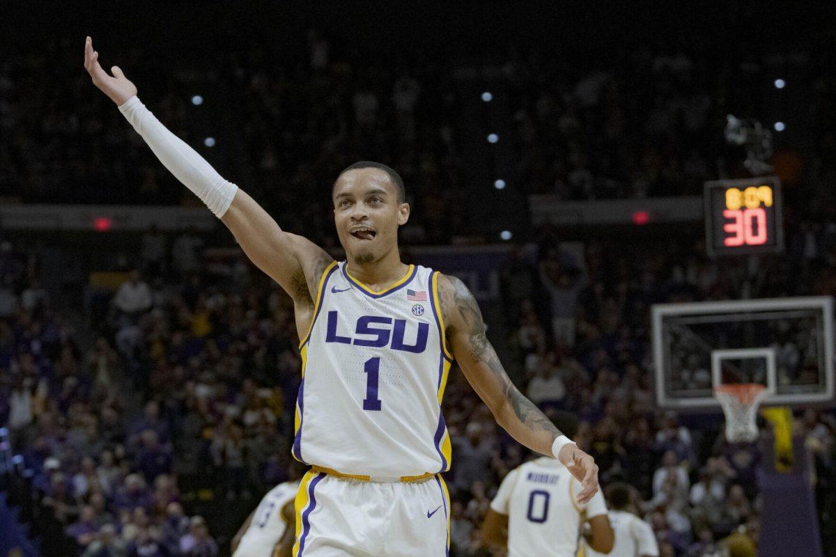 LSU guard Xavier Pinson (1) reacts to a score during the first half of an NCAA college basketball game against Tennessee in Baton Rouge, La., Saturday, Jan. 8, 2022. (AP Photo/Matthew Hinton)