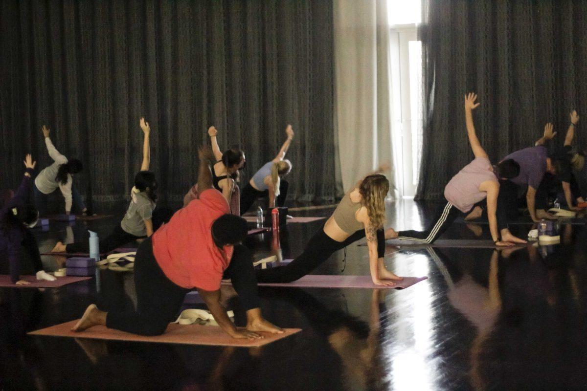 The Yoga For Relaxation class goes into a triangle pose stretch Jan. 26, 2022, at the LSU UREC in Baton Rouge, La.