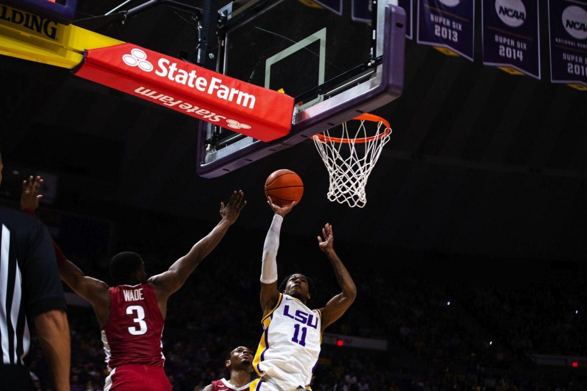LSU men’s basketball freshman guard Justice Williams (11) goes up for a layup Saturday, Jan. 15, 2022, during LSU’s 65-58 loss against Arkansas in the Pete Maravich Assembly Center on North Stadium Drive in Baton Rouge, La.