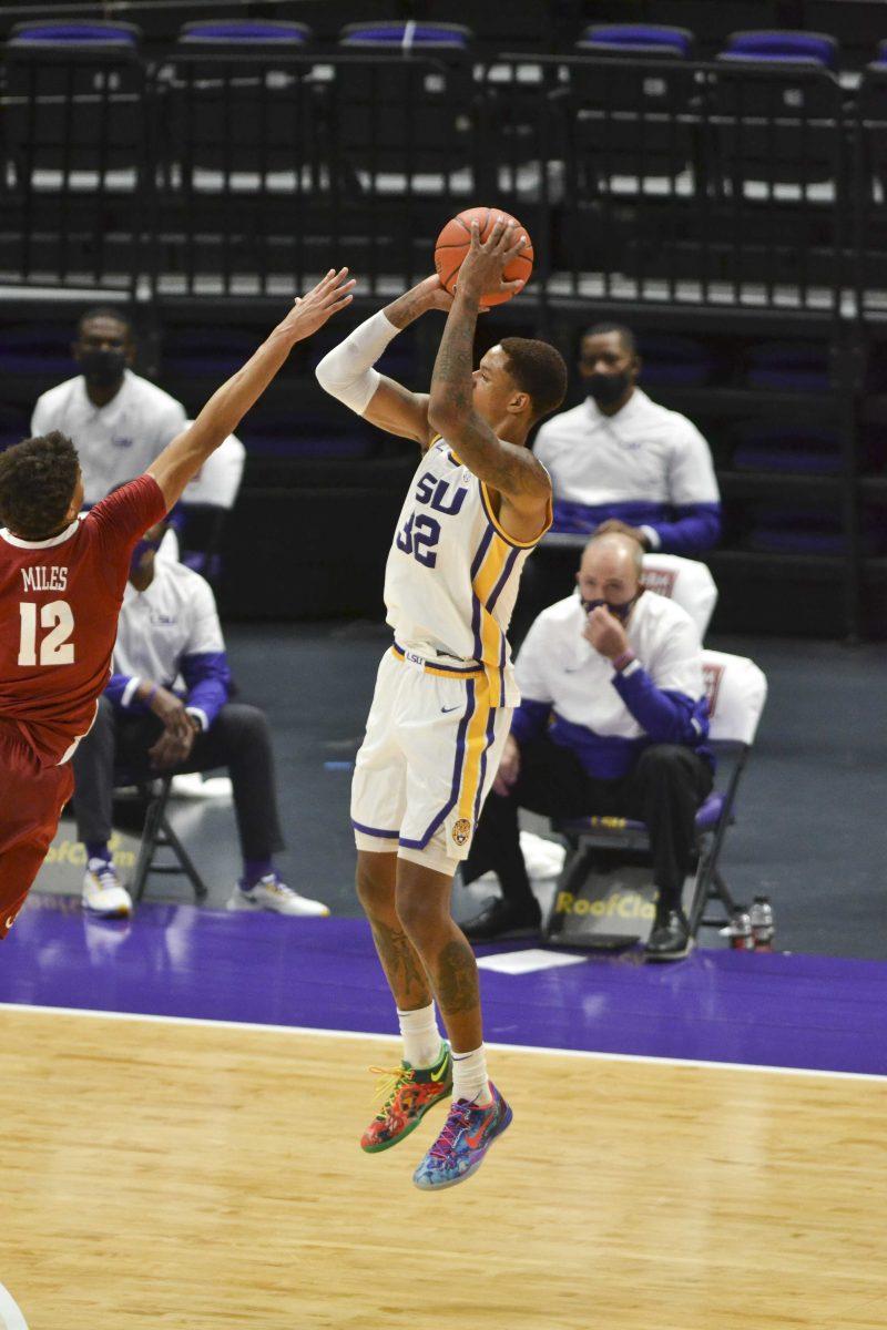 LSU men's basketball sophomore forward Shareef O'Neal (32) shoots over Alabama freshman forward Darius Miles (12) Tuesday, Jan. 19, 2021 during LSU's 75-105 loss to Alabama at Pete Maravich Assembley Center on N Stadium Drive in Baton Rouge, La.