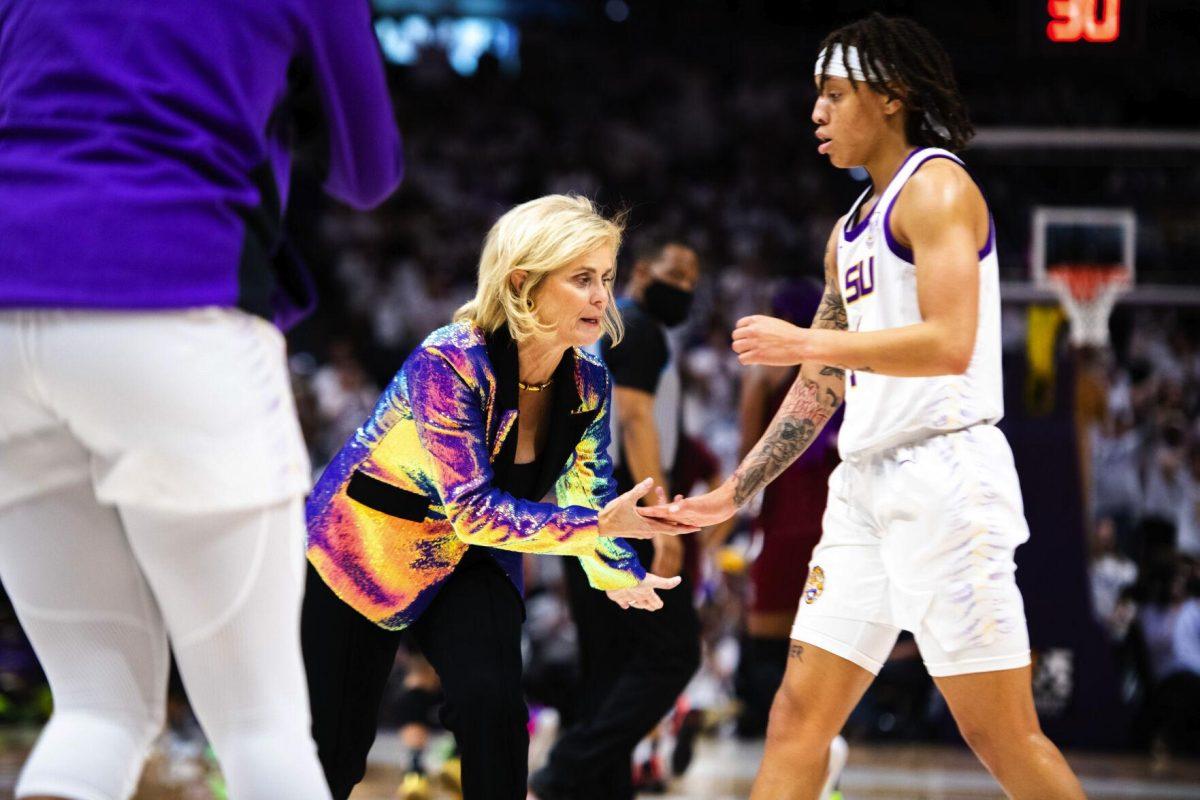 LSU women’s basketball head coach Kim Mulkey and graduate student guard Jailin Cherry (1) low five each other Thursday, Jan. 06, 2022, during LSU’s 66-60 loss against South Carolina in the Pete Maravich Assembly Center on North Stadium Drive in Baton Rouge, La.