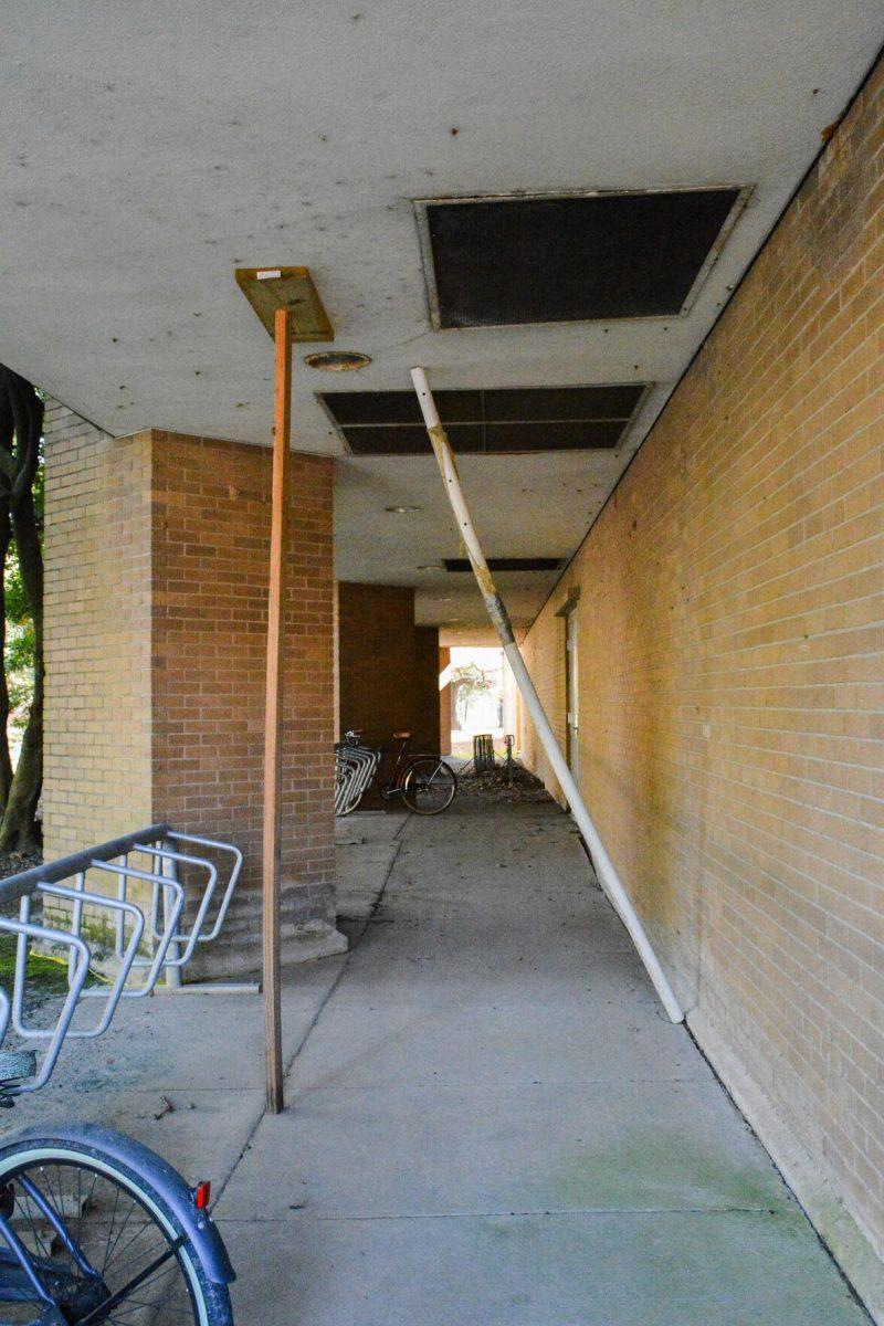 The outside of the renewable natural resources building walkway is being held up with a piece of wood and PVC pipe Thursday, Jan. 13, 2022, on Ag Center Lane in Baton Rouge, La.